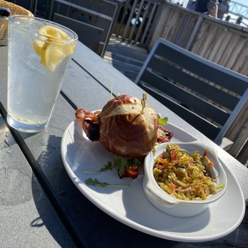 Elijah's Restaurant - Salmon on pretzel bun poppyseed dressing - Seafood Near Me - Wilmington, North Carolina Elijah's Restaurant - Salmon on pretzel bun poppyseed dressing - Seafood Near Me - Wilmington, North Carolina