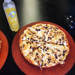 Pizza comes on this brown plate