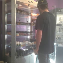 Just Breathe Vapors - Casey grabbing Alchemist liquid for a customer.