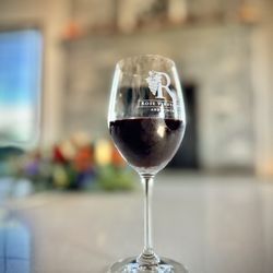 Rose Vineyards and Winery - Glass of Rose vineyards seasonal blueberry inspired wine, very tasty not too tart.