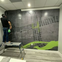 5 AM Vinyl - Hands-on from start to finish. Our owner getting it done with a full wall install at a commercial location because quality starts at the top