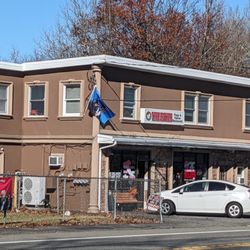 Three brothers pizza and italian restaurant - Three Brother's covered in trump flags.