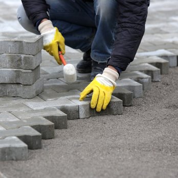 EV Landscape Services - a man placing bricks on a sidewalk - Landscaping Near Me - San Jose, California EV Landscape Services - a man placing bricks on a sidewalk - Landscaping Near Me - San Jose, California