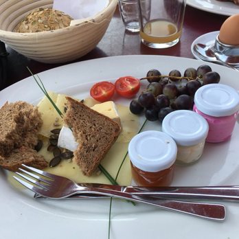 Dinzler Kaffeerösterei - Cheese, jam, butter, German roles and bread, an egg, and a huge bowl of yoghurt with fresh fruit and biercher muesli--perfect. - Cafes Near Me - Irschenberg, BY