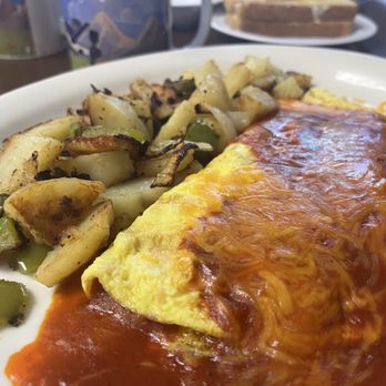 The Morning Griddle Cafe - Enchilada Omelette with Potatoes - Breakfast & Brunch Near Me - Lancaster, California The Morning Griddle Cafe - Enchilada Omelette with Potatoes - Breakfast & Brunch Near Me - Lancaster, California