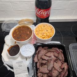 The Butcher Boss - Wednesday Family Meal. Chewy Tri Tip, Cowboy Beans, 2 liter bottle of Coke. Plus large side of mac and cheese