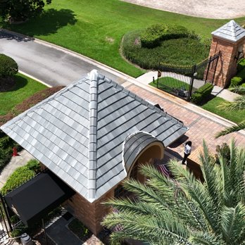 West Orange Roofing - West Orange Roofing project showcasing tile roofing installation by roofers in Windermere, FL near gated residential entrance. - Roofing Near Me - Auburndale, Florida West Orange Roofing - West Orange Roofing project showcasing tile roofing installation by roofers in Windermere, FL near gated residential entrance. - Roofing Near Me - Auburndale, Florida