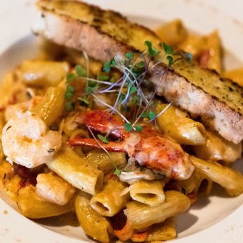 The Feast Restaurant - Lobster and Shrimp Lafayette: Maine Lobster, Gulf Shrimp, Roasted Red Peppers, Mushrooms, Spice, Cream, Rigatoni - Seafood Near Me - Holmes Beach, Florida