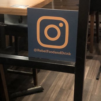 Rebel Food & Drink - a sign in a restaurant - Wine Bars Near Me - Edmonton, Alberta Rebel Food & Drink - a sign in a restaurant - Wine Bars Near Me - Edmonton, Alberta