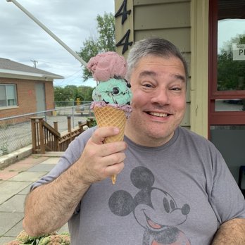 Chill Zone - My husband with a three flavor double scoop! OMG  Blackberry chocolate chunk, McQuires Mint Chip, and Black Cherry. - Ice Cream & Frozen Yogurt Near Me - Port Hope, Michigan