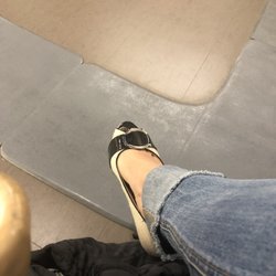 Kaiser Permanente Medical Center-Santa Rosa - Seats have no place for feet given preordained wait line shown in grey mats
