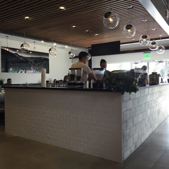 Sweet Bloom Coffee Roasters - Behind the order counter. Seating available on the sides and in the back. - Coffee & Tea Near Me - Arvada, Colorado Sweet Bloom Coffee Roasters - Behind the order counter. Seating available on the sides and in the back. - Coffee & Tea Near Me - Arvada, Colorado
