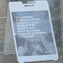 With the delta variant spiking and the CDC reversing the guidance in this sign, it's wrong to encourage customers to enter without masks.