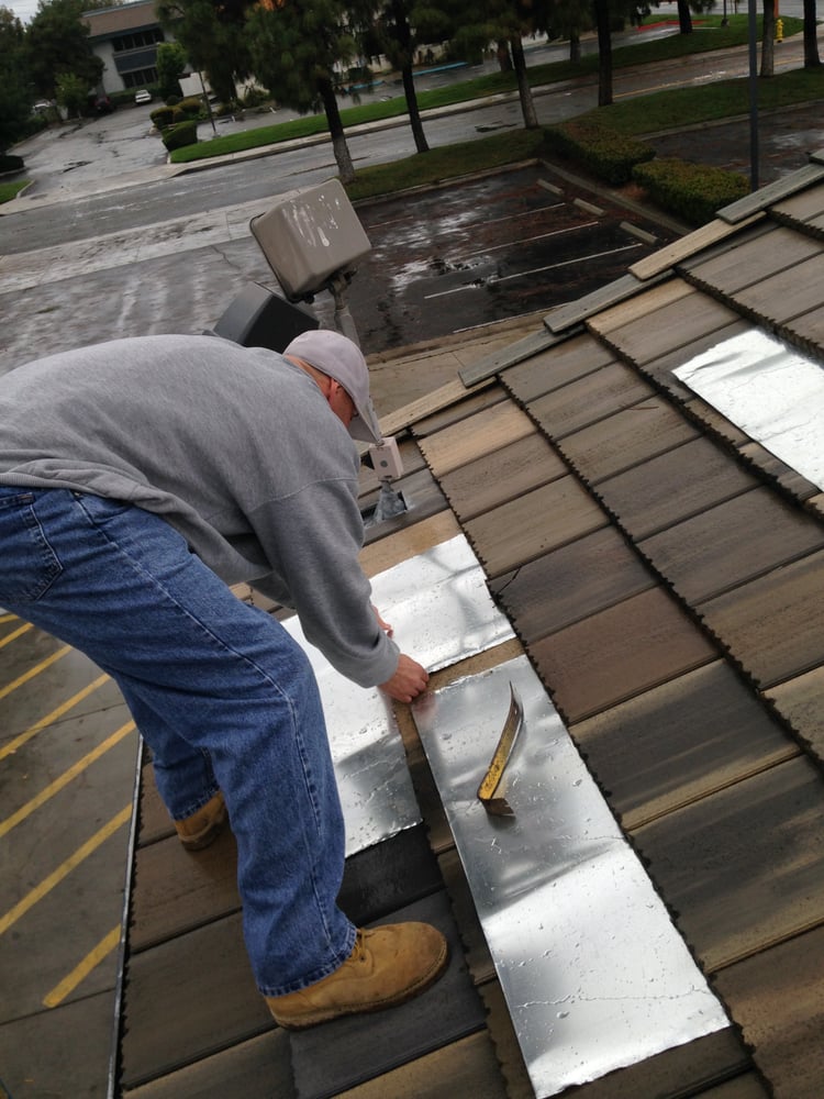 Slide of Hector's Roofing