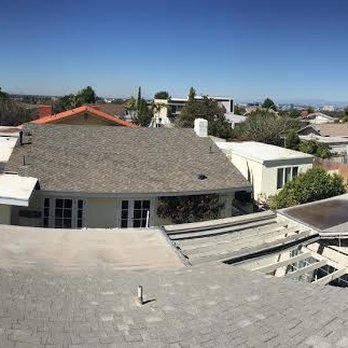 Vision Roof Services - Roof before. Notice the huge red lake of water on the right and the pond on the left. - Roofing Near Me - Mission Viejo, California