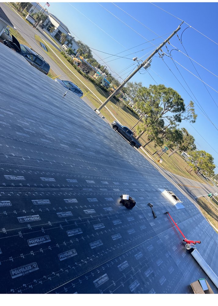 Slide of Ark Roofing and solar