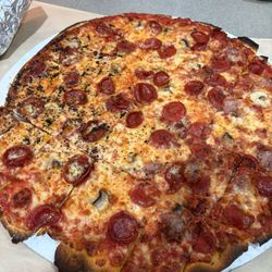 Pickup's Pizza Company - Half for the kids is nothing but charred bits. Half for the grown ups---still searching for the toppings.