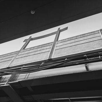 CTA - Belmont [Red, Brown, Purple ] - Belmont station and the back side of the sign from below - Public Transportation Near Me - Chicago, Illinois