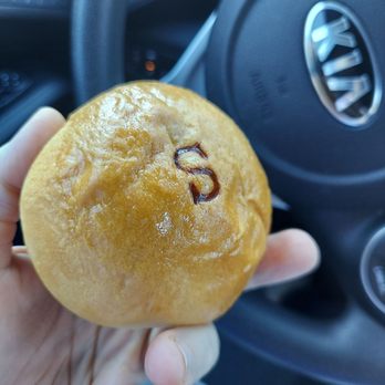 JC Donuts - a person holding a donut in their hand - Donuts Near Me - Dallas, Texas JC Donuts - a person holding a donut in their hand - Donuts Near Me - Dallas, Texas