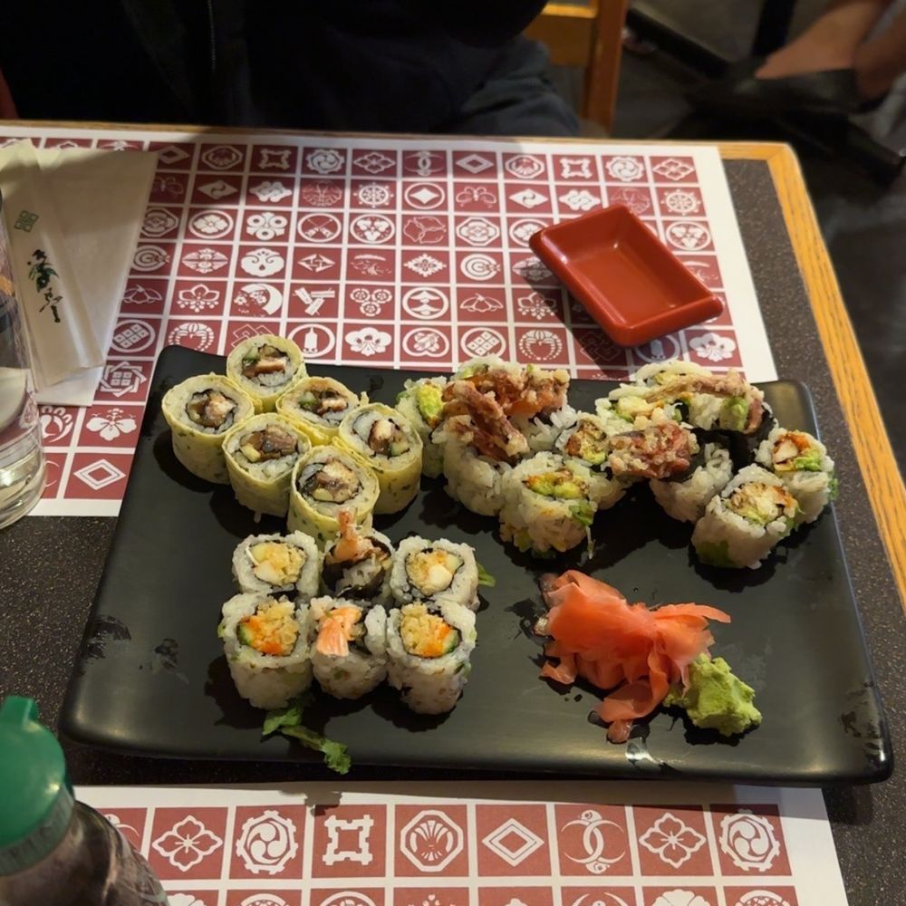 a plate of sushi rolls