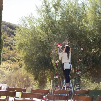 Merci Bouquet - Set up photo of Kathy from merci bouquet setting up my ceremony arch - Florists Near Me