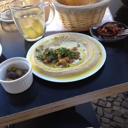 Hummus, olives, eggplant, pappadum and fresh ginger tea