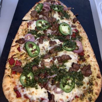 Topgolf - CHAR-GRILLED STEAK ($12): Marinated steak + grilled red onion + five-cheese blend + chimichurri + fresh jalapeño + piquillo peppers(770 CAL - New American Near Me - Edison, New Jersey Topgolf - CHAR-GRILLED STEAK ($12): Marinated steak + grilled red onion + five-cheese blend + chimichurri + fresh jalapeño + piquillo peppers(770 CAL - New American Near Me - Edison, New Jersey