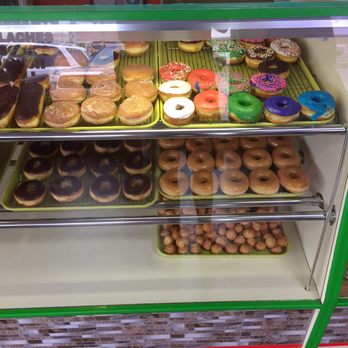 Snowflake - a variety of donuts in a display case - Donuts Near Me - Shiner, Texas