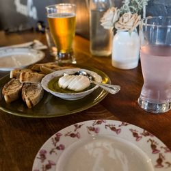 A Dopo Sourdough Pizza - Appetizer of fresh Mozzarella in pesto and olive oil with fresh, hot sourdough bread.