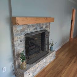 Capeside Home Improvement - stone work I did around a fireplace. built the wood mantle.