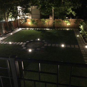 Faber Cnk Stone - Nighttime yard and paver pathway from balcony - Flooring Near Me - Houston, Texas