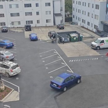 Oakbrook Manor - Parking lot view - Apartments Near Me - Oakland, California
