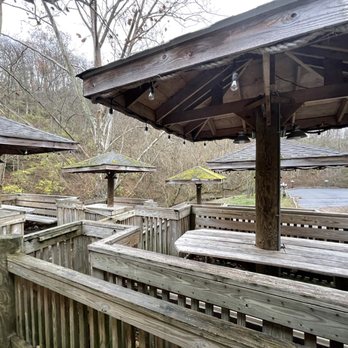 Hall's On the River - a wooden deck with umbrellas - Southern Near Me - Winchester, Kentucky