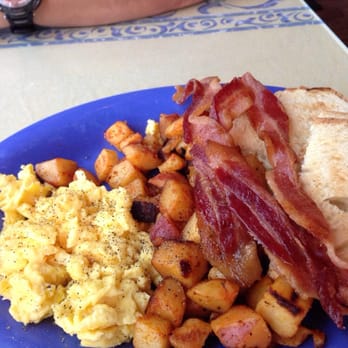 Over Easy Cafe - Eggs bacon home fries and toast - Breakfast & Brunch Near Me - Sanibel, Florida Over Easy Cafe - Eggs bacon home fries and toast - Breakfast & Brunch Near Me - Sanibel, Florida
