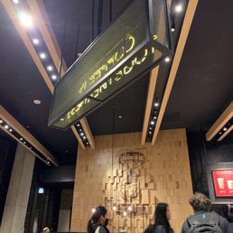 people standing in a coffee shop people standing in a coffee shop