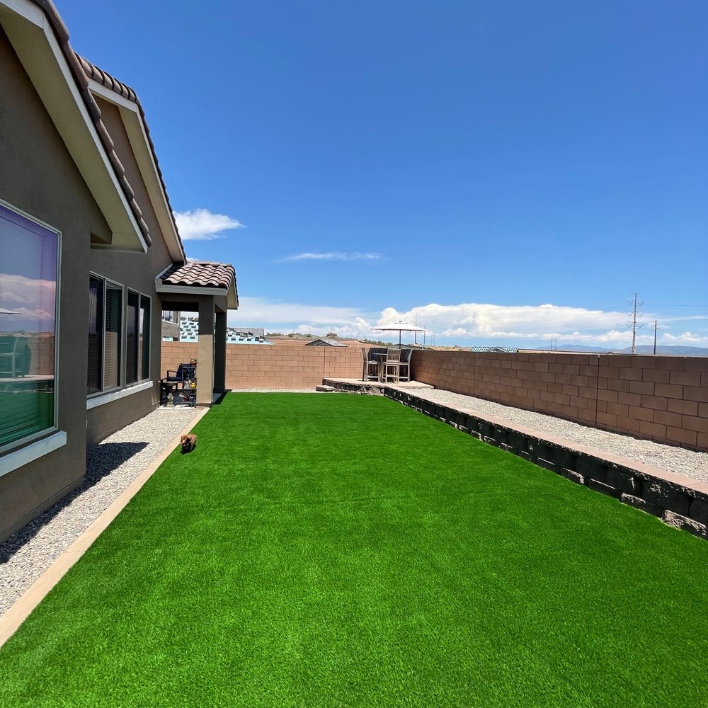 AMG Landscape - View of the yard, showing the block wall and planter areas. - Irrigation Near Me AMG Landscape - View of the yard, showing the block wall and planter areas. - Irrigation Near Me