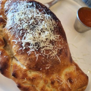 Pazzeria By Pietro's - Meat lovers calzone, fabulous bread. Don't let the puffiness fool you... it was all air. Some meat in the center with very little cheese. - Italian Near Me - Marshall, Texas Pazzeria By Pietro's - Meat lovers calzone, fabulous bread. Don't let the puffiness fool you... it was all air. Some meat in the center with very little cheese. - Italian Near Me - Marshall, Texas
