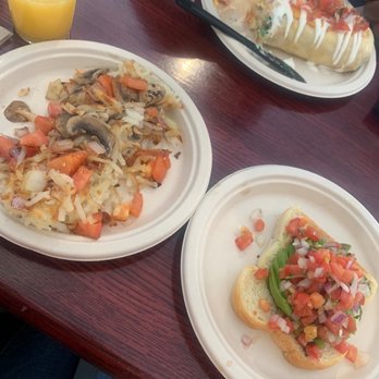 Tony's Diner - Loaded hash brown, avocado toast and mimosa . Veggie breakfast burrito in back. - Diners Near Me - Minneapolis, Minnesota