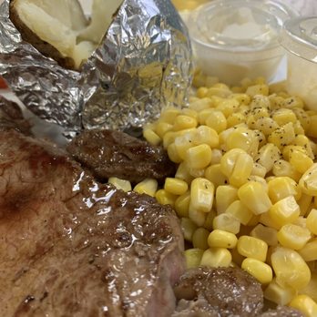 Tumbleweeds Bar & Grill - Close up on the rib-eye, corn and baked potato! - Bars Near Me - Mattawa, Washington