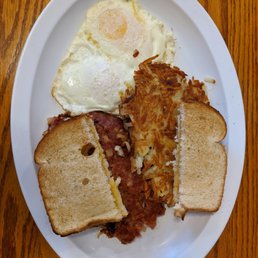 Corned-beef hash, hashbrowns, toast, and over-easy eggs. Corned-beef hash, hashbrowns, toast, and over-easy eggs.