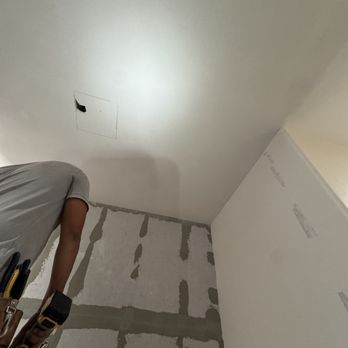 4Hermanos Electric - Preparing the drywall to install a new restroom exhaust - Electricians Near Me - Brownsville, Texas 4Hermanos Electric - Preparing the drywall to install a new restroom exhaust - Electricians Near Me - Brownsville, Texas