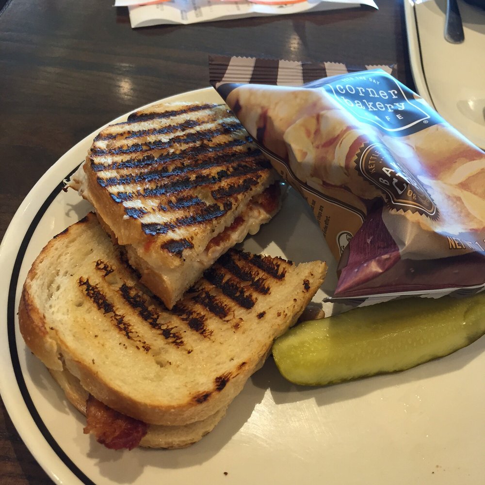 Corner Bakery Cafe - Panini sandwich- turkey, bacon, tomato, and mayo on sourdough bread. Full size. - Cafes Near Me - McAllen, Texas Corner Bakery Cafe - Panini sandwich- turkey, bacon, tomato, and mayo on sourdough bread. Full size. - Cafes Near Me - McAllen, Texas
