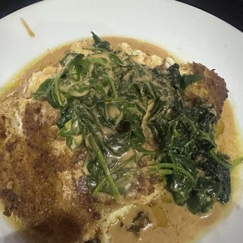 GTs On The Bay - GTs Grouper with Parmesan Cheese Grits and sautéd spinach. - American Near Me - Orange Beach, Alabama GTs On The Bay - GTs Grouper with Parmesan Cheese Grits and sautéd spinach. - American Near Me - Orange Beach, Alabama