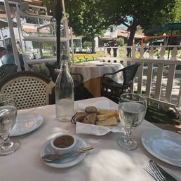 Freshly baked bread and olive tapenade with a view