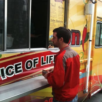 The Latin Wagon - a man ordering food from the side of the truck - Street Vendors Near Me The Latin Wagon - a man ordering food from the side of the truck - Street Vendors Near Me