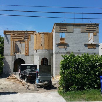 Built Properly - a truck parked in front of a house under construction - Masonry/Concrete Near Me - Miami, Florida