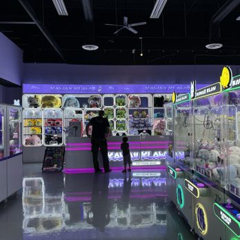 Kawaii Klaws - Claw machine counter with upgrade plushies behind it, and claw machine arcades on the sides. - Arcades Near Me - Buena Park, California