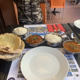 Chicken tikka masala, cheese and butter naan, fish stew curry, rice
