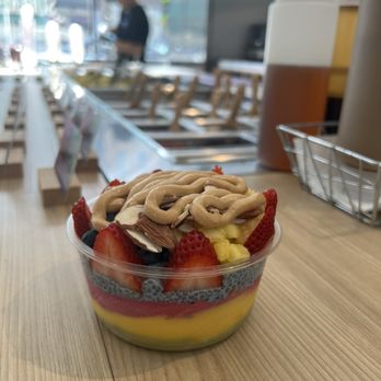 Small bowl with Matcha, Mango, Pitya, Boom Chia, Ancient Grains, fruit, almonds & peanut butter