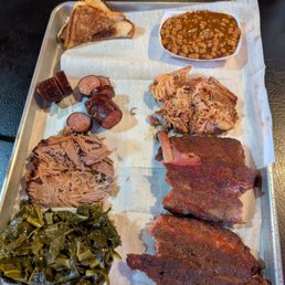 Pit Master with ribs, collards, pulled pork and chicken, baked beans and sausage!